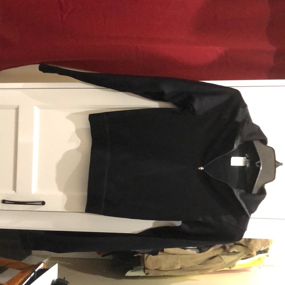 Black medium sized  collared shirt.